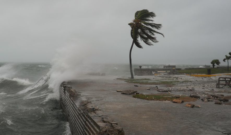 Waves splash in Kingston, Jamaica, as Hurricane Melissa approaches, Tuesday, Oct. 28, 2025. (AP Photo/Matias Delacroix)