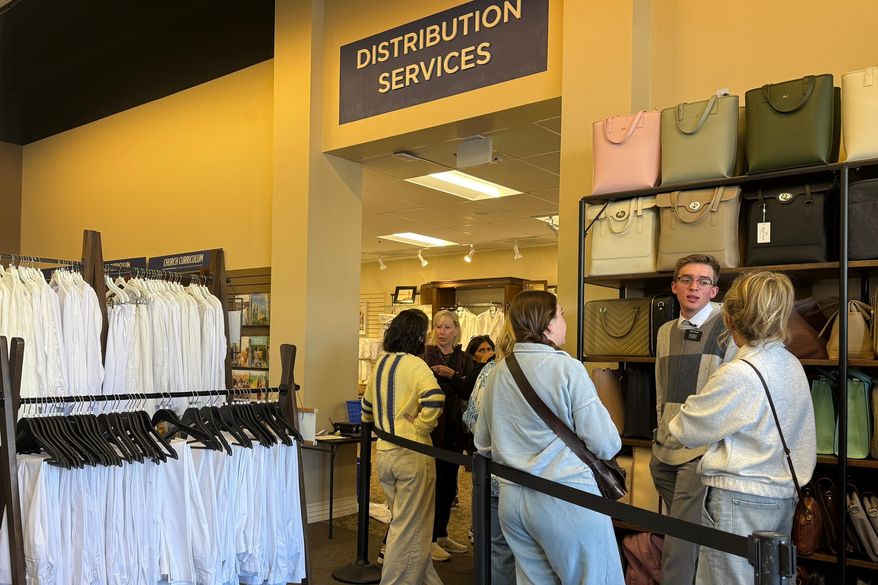 Members of The Church of Jesus Christ of Latter-day Saints shop for new sleeveless sacred garments at Deseret Book in Salt Lake City on Tuesday, Oct. 28, 2025. (AP Photo/Hannah Schoenbaum)