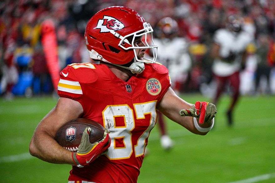 Kansas City Chiefs tight end Travis Kelce (87) picks up 38 yards on an improvised third-quarter play against the Washington Commanders at GEHA Field at Arrowhead Stadium in Kansas City, Missouri, October 27, 2025. (Photo by Brian Murphy for the Washington Times)