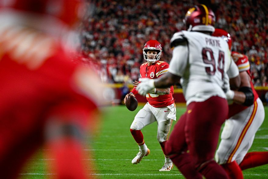 Kansas City Chiefs quarterback Patrick Mahomes (15) scans downfield for an open receiver on 3rd-and-goal during the third quarter against the Washington Commanders at GEHA Field at Arrowhead Stadium in Kansas City, Missouri, October 27, 2025. (Photo by Brian Murphy for the Washington Times)