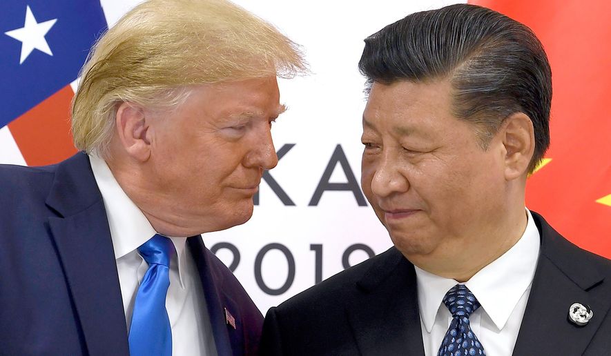 FILE - U.S. President Donald Trump, left, meets with Chinese President Xi Jinping during a meeting on the sidelines of the G-20 summit in Osaka, Japan, June 29, 2019. (AP Photo/Susan Walsh, File)