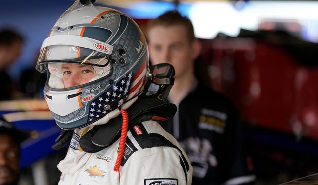 FILE - ARCA driver Marco Andretti looks out of the garage before a practice run for an ARCA Mendards Series auto race Thursday, Feb. 15, 2024, at Daytona International Speedway in Daytona Beach, Fla. (AP Photo/Chris O'Meara, file)