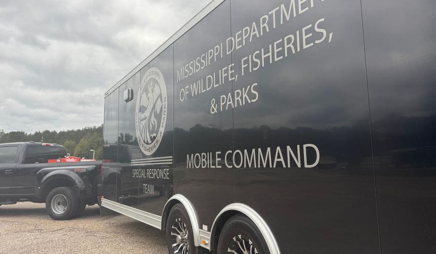 The Mississippi Department of Wildlife, Fisheries and Parks set up a mobile command in Heidelberg, Miss. on Oct. 25, 2025. (AP Photo/Sophie Bates)