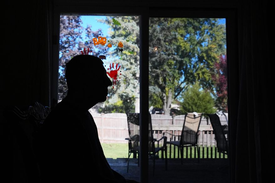 Bill Swick sits on the chair at his home in Minooka, Ill., Friday, Oct. 24, 2025. (AP Photo/Nam Y. Huh)