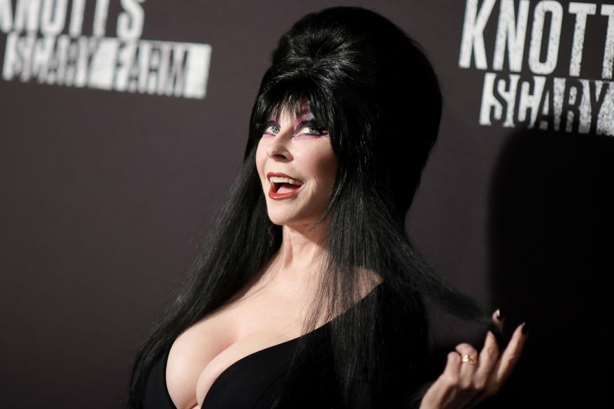 FILE - Cassandra Peterson appears at the 2016 Knott's Scary Farm Black Carpet Event at Knott's Berry Farm in Buena Park, Calif., on Sept. 30, 2016, (Photo by Richard Shotwell/Invision/AP, File)
