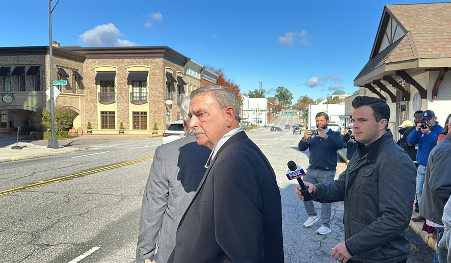Former Spartanburg County Sheriff Chuck Wright walks out of court after pleading guilty to theft and conspiracy charges on Thursday, Oct. 30, 2025, in Anderson, S.C. (AP Photo/Jeffrey Collins)