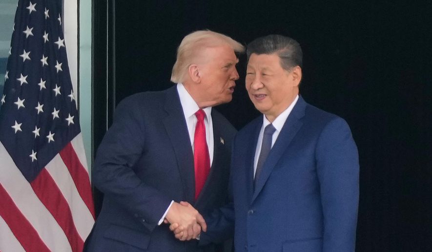 President Donald Trump, left, and Chinese President Xi Jinping, right, shake hands after their U.S.-China summit meeting at Gimhae International Airport Jinping in Busan, South Korea, Thursday, Oct. 30, 2025. (AP Photo/Mark Schiefelbein)