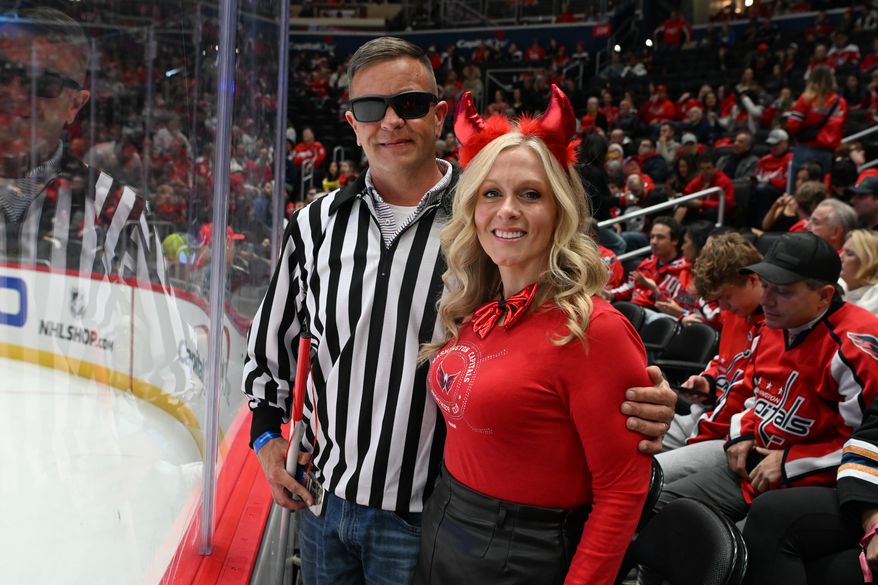 Two Washington Capitals fans dressed for Halloween during the first period of an NHL game against the New York Islanders at Capital One Arena in Washington D.C., October 31, 2025. (Photo for the Washington Times)