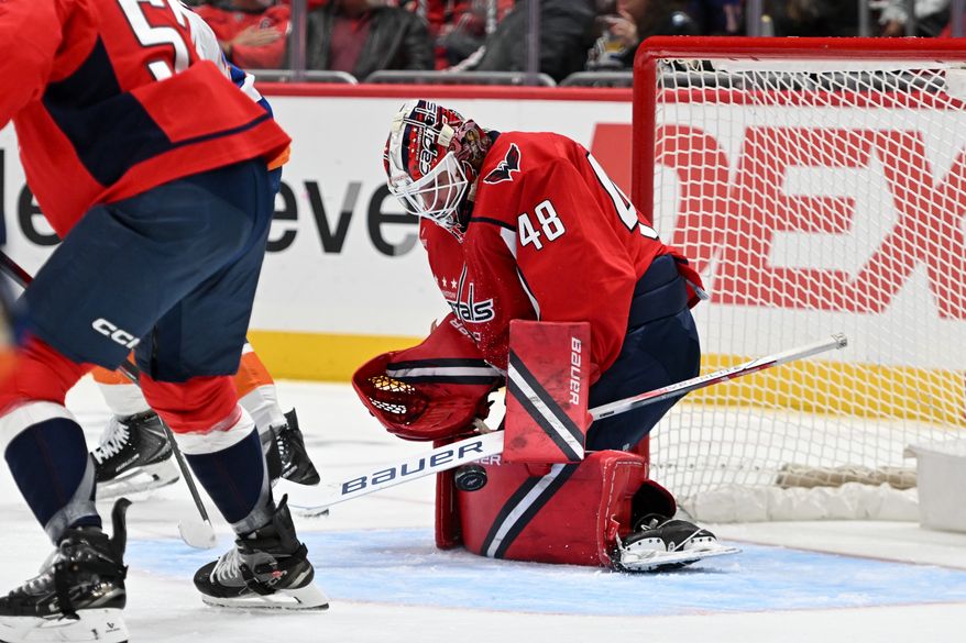 Washington Capitals goalie Logan Thompson (48) making a save during the second period of an NHL game against the New York Islanders at Capital One Arena in Washington D.C., October 31, 2025. (Photo for the Washington Times)