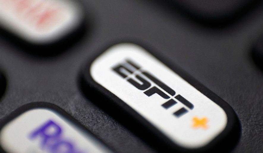 FILE — This Aug. 13, 2020 file photo shows a logo for ESPN on a remote control, in Portland, Ore. (AP Photo/Jenny Kane, FIle)