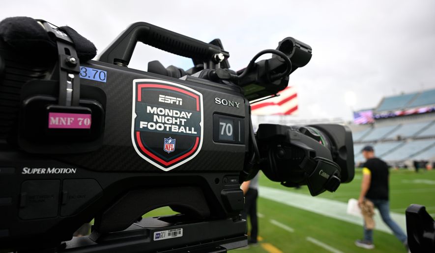 An ESPN Monday Night Football logo is viewed on a broadcast camera before an NFL football game between the Jacksonville Jaguars and the Kansas City Chiefs, Monday, Oct. 6, 2025, in Jacksonville, Fla. (AP Photo/Phelan M. Ebenhack, File)