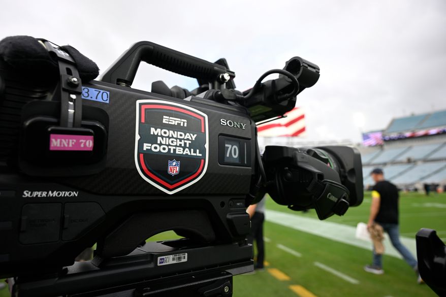 An ESPN Monday Night Football logo is viewed on a broadcast camera before an NFL football game between the Jacksonville Jaguars and the Kansas City Chiefs, Monday, Oct. 6, 2025, in Jacksonville, Fla. (AP Photo/Phelan M. Ebenhack, File)