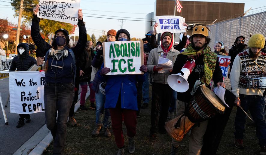 Protesters gather outside an ICE processing facility in the Chicago suburb of Broadview, Ill., Friday, Oct. 31, 2025. (AP Photo/Nam Y. Huh)