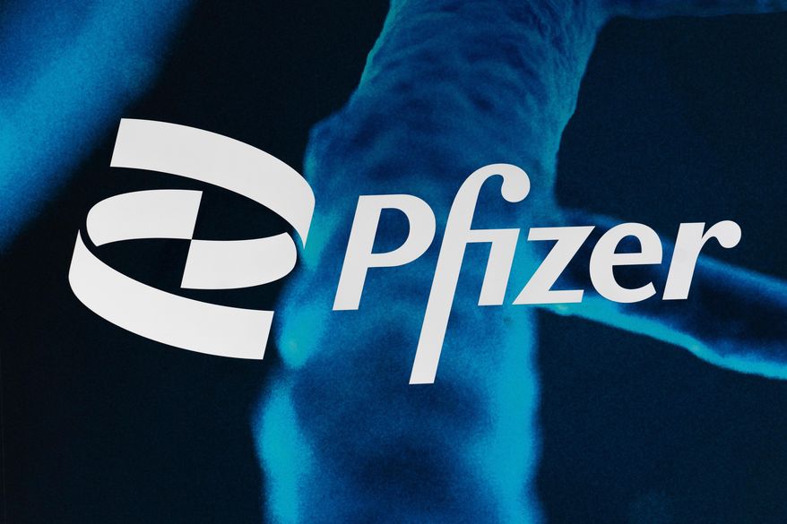 The Pfizer logo is displayed at the company's headquarters, Friday, Feb. 5, 2021, in New York. (AP Photo/Mark Lennihan, File)