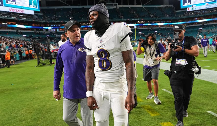 Baltimore Ravens quarterback Lamar Jackson (8) leaves the field after a win over the Miami Dolphins in an NFL football game, Thursday, Oct. 30, 2025, in Miami Gardens, Fla. (AP Photo/Lynne Sladky)