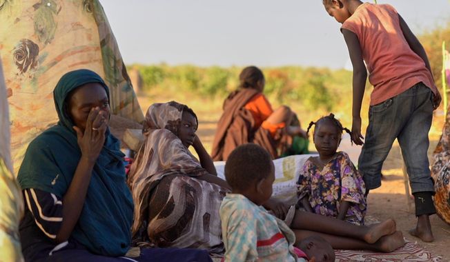 This photo released by UNICEF shows displaced children and families from el-Fasher at a displacement camp where they sought refuge from fighting between government forces and the RSF, in Tawila, Darfur region, Sudan, Monday, Oct. 27, 2025. (Mohammed Jammal/UNICEF via AP)