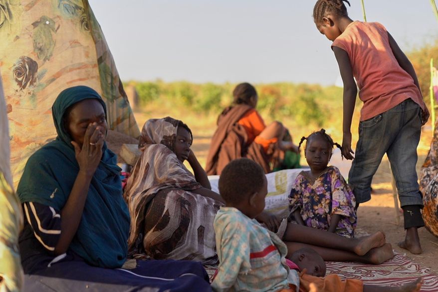 This photo released by UNICEF shows displaced children and families from el-Fasher at a displacement camp where they sought refuge from fighting between government forces and the RSF, in Tawila, Darfur region, Sudan, Monday, Oct. 27, 2025. (Mohammed Jammal/UNICEF via AP)