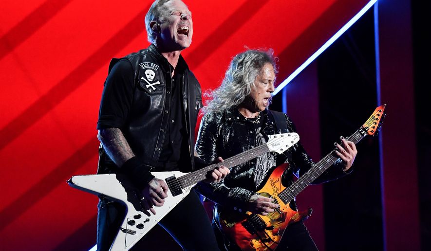 James Hetfield, left, and Kirk Hammett of Metallica perform during the Global Citizen Festival on Saturday, Sept. 24, 2022, at Central Park in New York. Metallica's latest album, "72 Seasons," releases Friday. (Photo by Evan Agostini/Invision/AP, File)