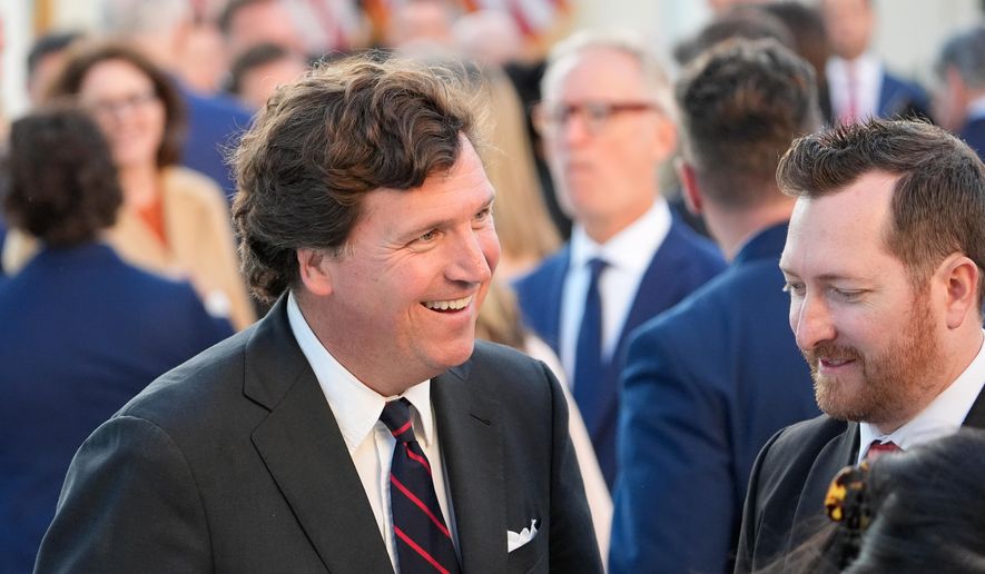 Tucker Carlson talks after President Donald Trump posthumously awarded the Presidential Medal of Freedom to Charlie Kirk in the Rose Garden of the White House, Tuesday, Oct. 14, 2025, in Washington. (AP Photo/Alex Brandon) ** FILE **