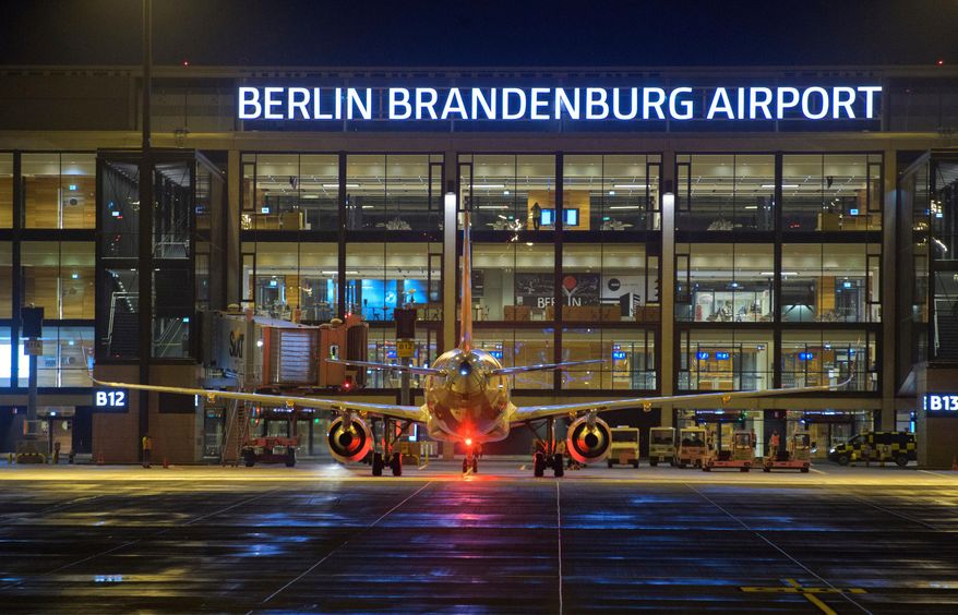 An easyJet airplane will be handled at Terminal 1 in the evening after the opening of the new Berlin Brandenburg "Willy Brandt" (BER) Airport, Saturday, Oct. 31, 2020, in Berlin, Germany. (Soeren Stache/dpa via AP, File)