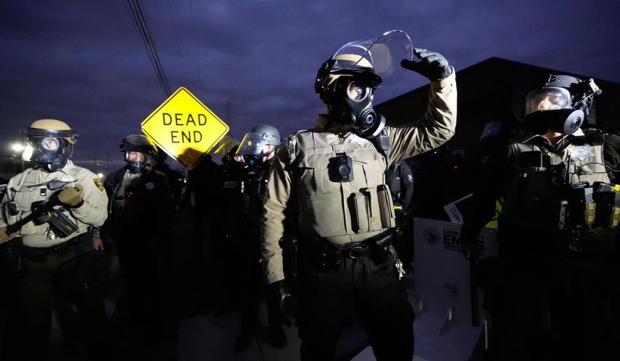 Law enforcement standoff with protesters outside an ICE processing facility in the Chicago suburb of Broadview, Ill., Saturday, Nov. 1, 2025. (AP Photo/Alex Brandon)