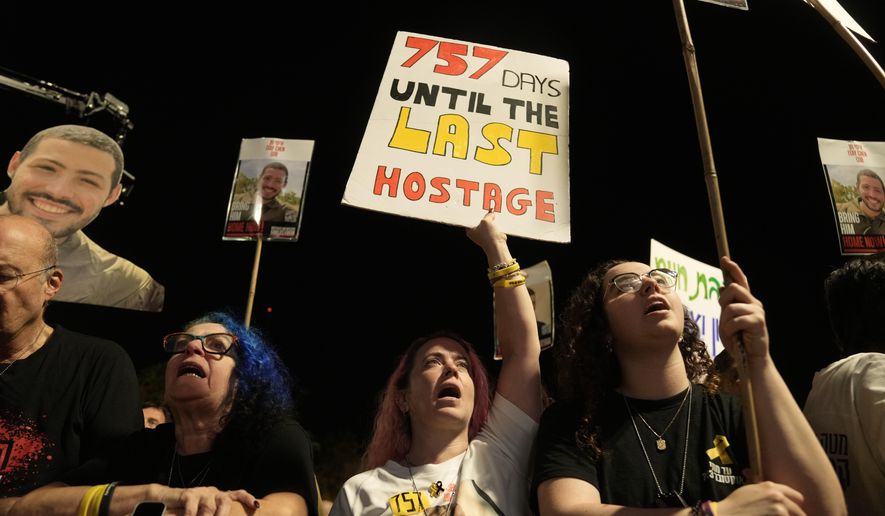 Relatives and supporters of hostages held by Hamas in the Gaza Strip attend a rally calling for their immediate release in Tel Aviv, Israel, Saturday, Nov. 1, 2025. (AP Photo/Mahmoud Illean)
