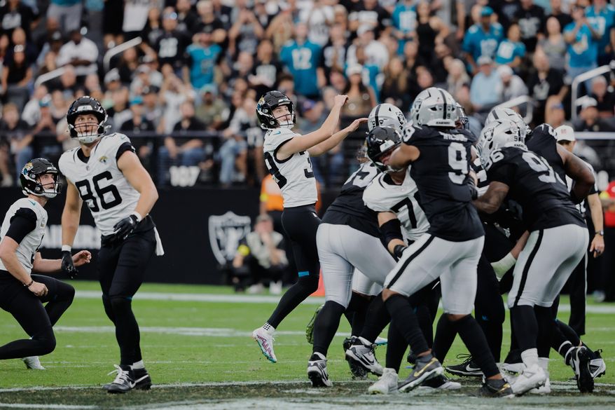 Jacksonville Jaguars place kicker Cam Little (39) watches his 68-yard field goal during the first half of an NFL football game against the Las Vegas Raiders, Sunday, Nov. 2, 2025, in Las Vegas. (AP Photo/Steve Marcus)
