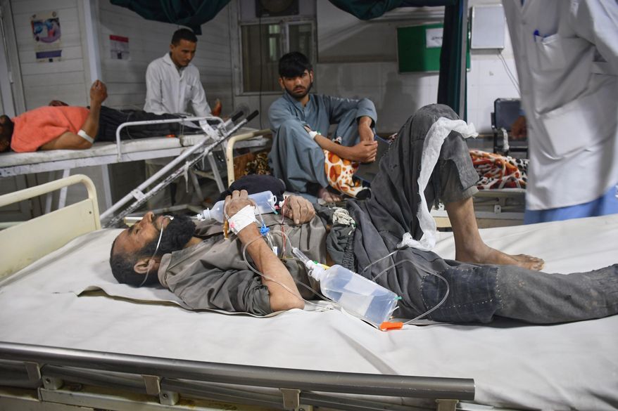 Injured residents of a 6.3 powerful earthquake in northern Afghanistan wait for treatment at a hospital in Mazar-e-Sharif, Afghanistan, Monday, Nov. 3, 2025.(AP Photo/Sirat Noori)
