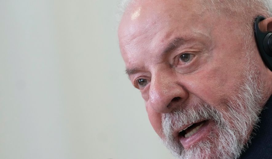 Brazil's President Luiz Inacio Lula da Silva speaks with the foreign media ahead of the COP30 U.N. Climate Summit in Belem, Para state, Tuesday, Nov. 4, 2025. (AP Photo/Eraldo Peres)