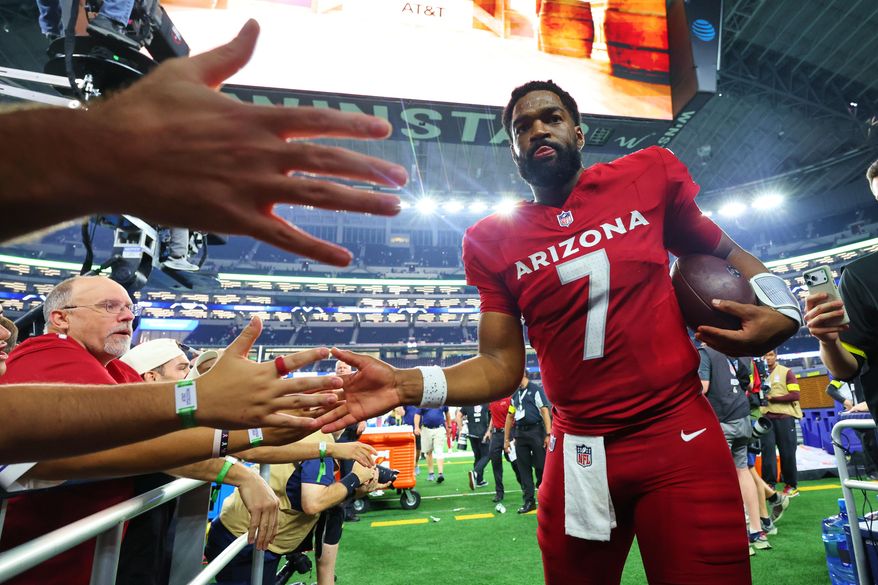 Arizona Cardinals' Jacoby Brissett (7) greets fans as he walks off the field following an NFL football game against the Dallas Cowboys Monday, Nov. 3, 2025, in Arlington, Texas. (AP Photo/Richard Rodriguez)