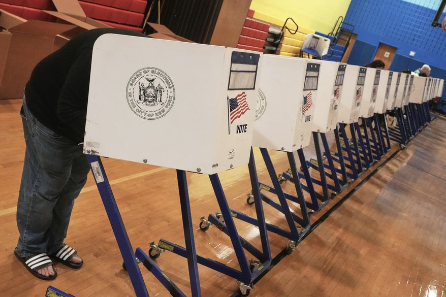 A voter completes their ballot at a voting site, in New York, Tuesday, Nov. 4, 2025. (AP Photo/Richard Drew)
