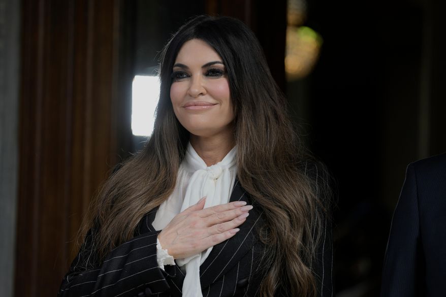 Kimberly Guilfoyle, the new U.S. Ambassador to Greece and first woman to hold the post, listen the national anthem next to Ambassador Dimitrios Zevelakis during a ceremony to present her diplomatic credentials at the Presidential Palace in Athens, Greece, Tuesday, Nov. 4, 2025. (AP Photo/Petros Giannakouris)