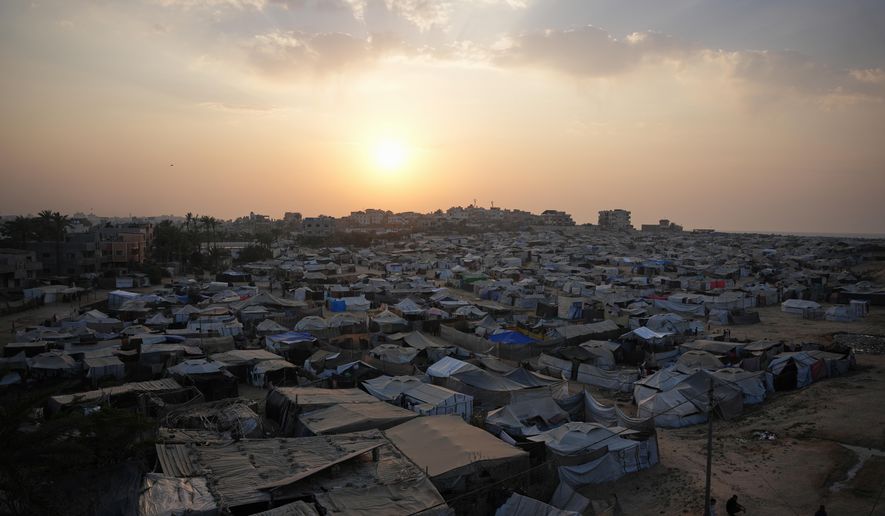 A tent camp for displaced Palestinians stretches along Zawaida in the central Gaza Strip on Tuesday, Nov. 4, 2025. (AP Photo/Abdel Kareem Hana)