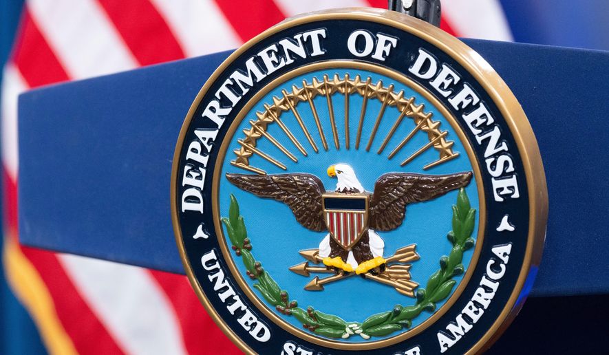 The Department of Defense seal is seen on the podium in the Press Briefing room at the Pentagon on Oct. 29, 2024, in Washington. (AP Photo/Kevin Wolf, File)