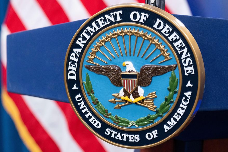 The Department of Defense seal is seen on the podium in the Press Briefing room at the Pentagon on Oct. 29, 2024, in Washington. (AP Photo/Kevin Wolf, File)