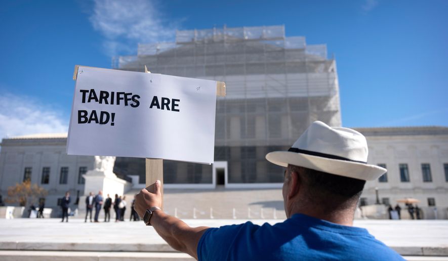 A demonstrator protests outside the Supreme Court on Wednesday, Nov. 5, 2025, in Washington. (AP Photo/Mark Schiefelbein)