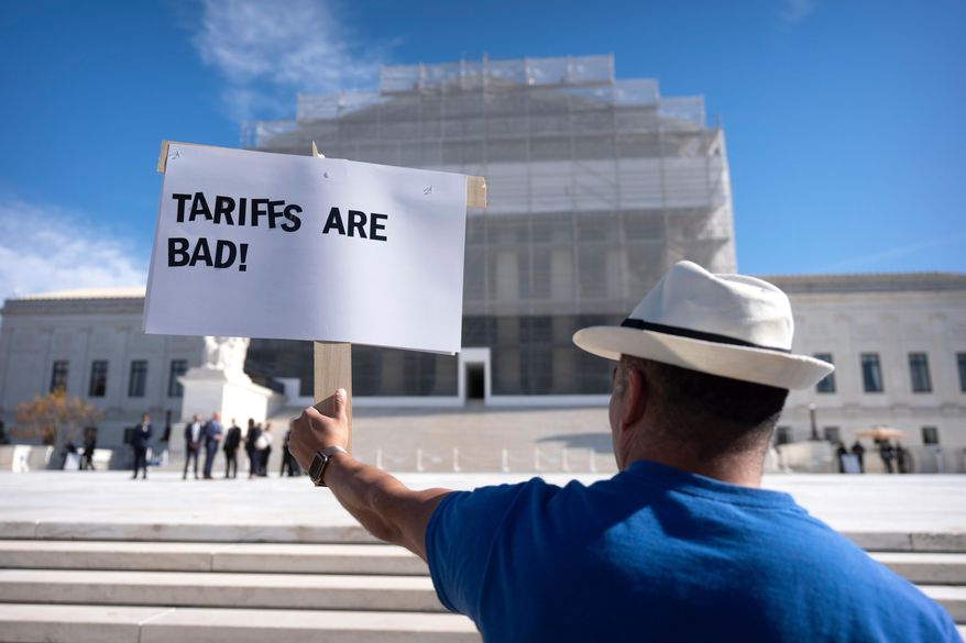 A demonstrator protests outside the Supreme Court on Wednesday, Nov. 5, 2025, in Washington. (AP Photo/Mark Schiefelbein)