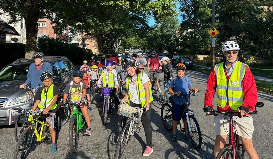 Children ride their bicycles to school during a parent-led bike ride titled "Bike Bus" Sept. 15, 2025, in Montclair, N.J. (Andrew Hawkins/Montclair Bike Bus via AP)