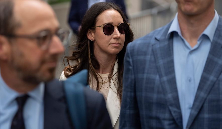 FILE - Charlie Javice, center, exits Manhattan federal court, Sept. 29, 2025, in New York. (AP Photo/Yuki Iwamura, File)