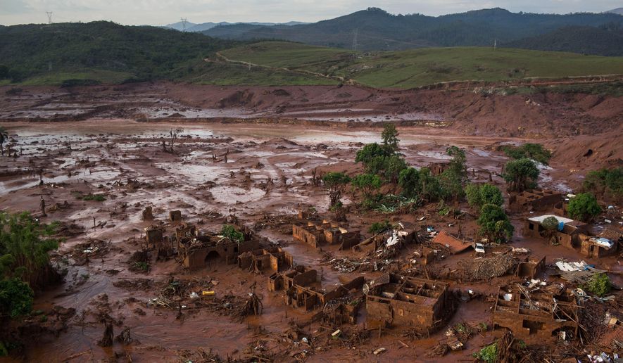 FILE - Debris is visible after a dam burst at the small town of Bento Rodrigues in Minas Gerais state, Brazil, Nov. 6, 2015. (AP Photo/Felipe Dana, File)