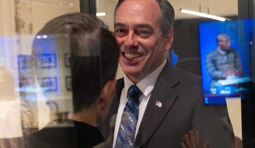 Public Service Commission candidate Peter Hubbard talks with Connie Di Cicco, political director for Georgia Conservation Voters, after arriving at their election night party in Southwest Atlanta, Tuesday, Nov. 4, 2025. (Ben Gray/Atlanta Journal-Constitution via AP)