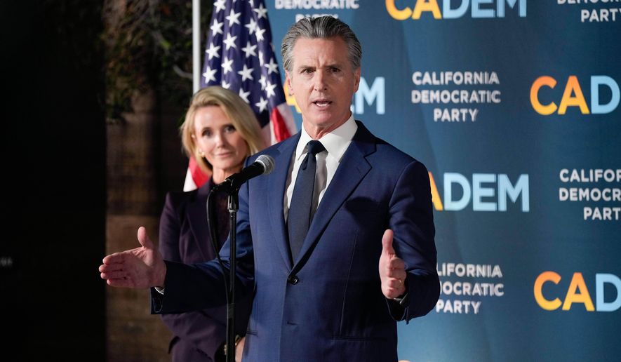 California Gov. Gavin Newsom stands with first partner Jennifer Siebel Newsom as he speaks during an election night press conference at a California Democratic Party office Tuesday, Nov. 4, 2025, in Sacramento, Calif. (AP Photo/Godofredo A. Vásquez)