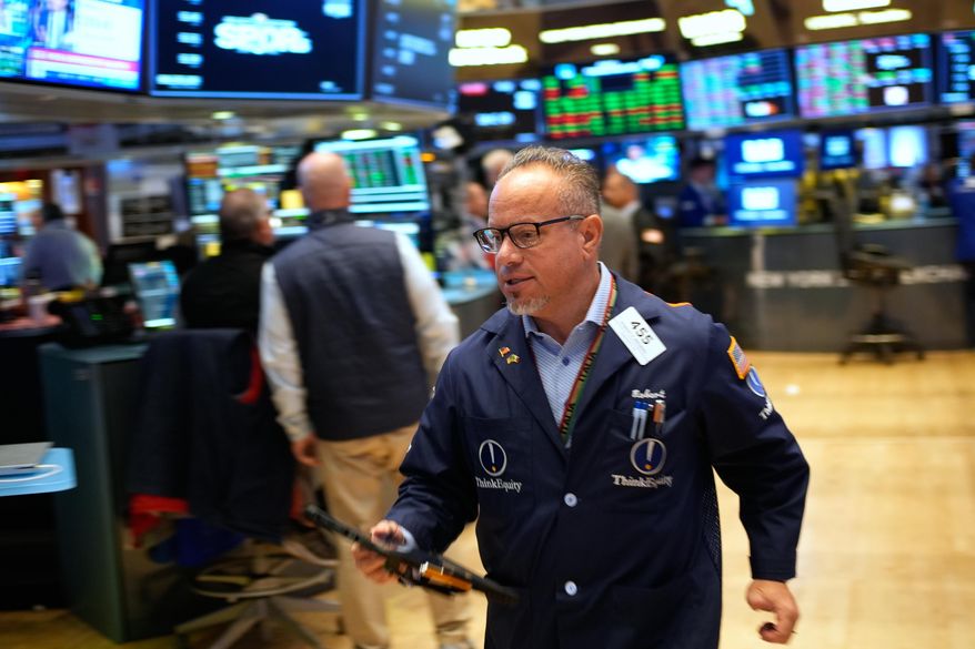 Robert Arciero works on the floor at the New York Stock Exchange in New York, Wednesday, Oct. 29, 2025. (AP Photo/Seth Wenig)