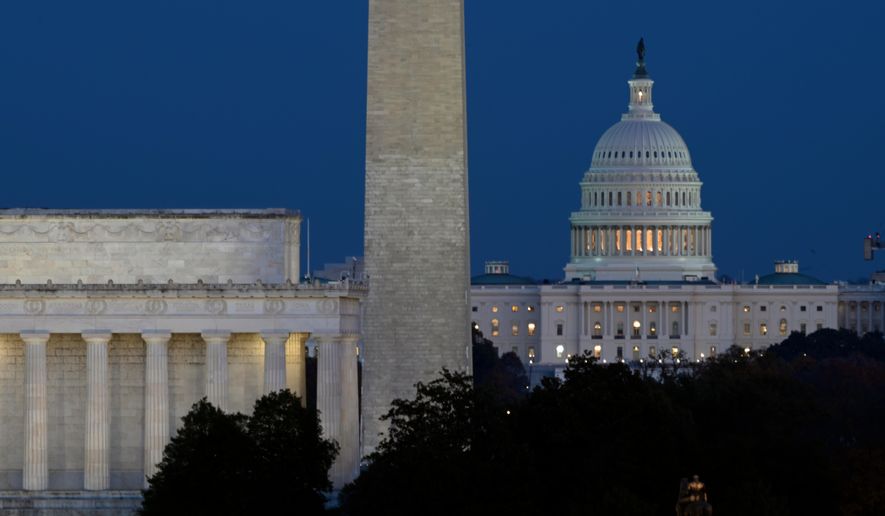 The Lincoln Memorial, Washington Monument and the U.S. Capitol can be seen together in this file photo, Washington, Tuesday, Nov. 4, 2025. (AP Photo/John McDonnell) ** FILE **