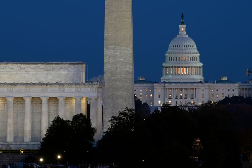 The Lincoln Memorial, Washington Monument and the U.S. Capitol can be seen together in this file photo, Washington, Tuesday, Nov. 4, 2025. (AP Photo/John McDonnell) ** FILE **