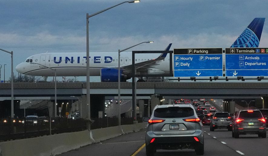 An United Airlines flight arrives at O'Hare International Airport in Chicago, Monday, Nov. 3, 2025. (AP Photo/Nam Y. Huh)