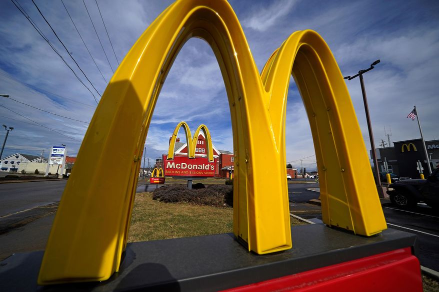 FILE - McDonald's restaurant signs are shown in in East Palestine, Ohio, Feb. 9, 2023. (AP Photo/Gene J. Puskar, File)