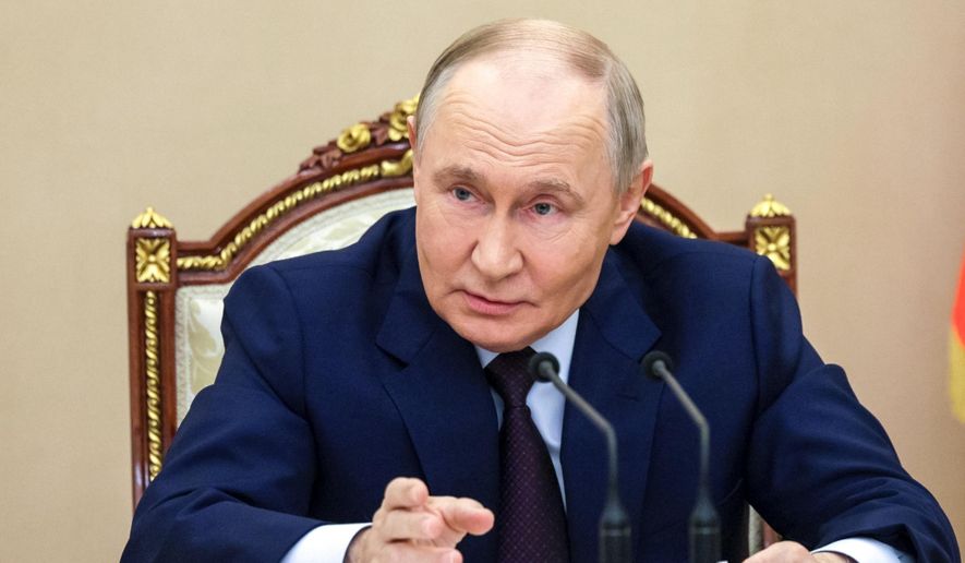 Russian President Vladimir Putin chairs a meeting with members of the Security Council in Moscow, Russia, Wednesday, Nov. 5, 2025. (Gavriil Grigorov, Sputnik, Kremlin Pool Photo via AP)