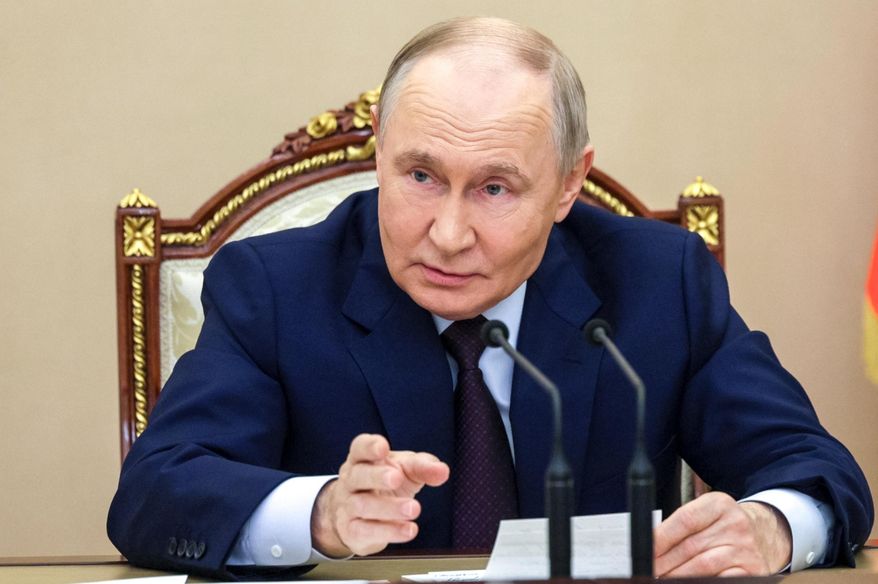 Russian President Vladimir Putin chairs a meeting with members of the Security Council in Moscow, Russia, Wednesday, Nov. 5, 2025. (Gavriil Grigorov, Sputnik, Kremlin Pool Photo via AP)