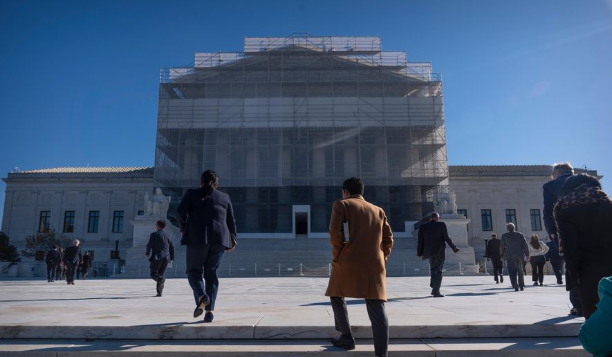 People arrive to attend oral arguments at the Supreme Court on Wednesday, Nov. 5, 2025, in Washington. (AP Photo/Mark Schiefelbein)